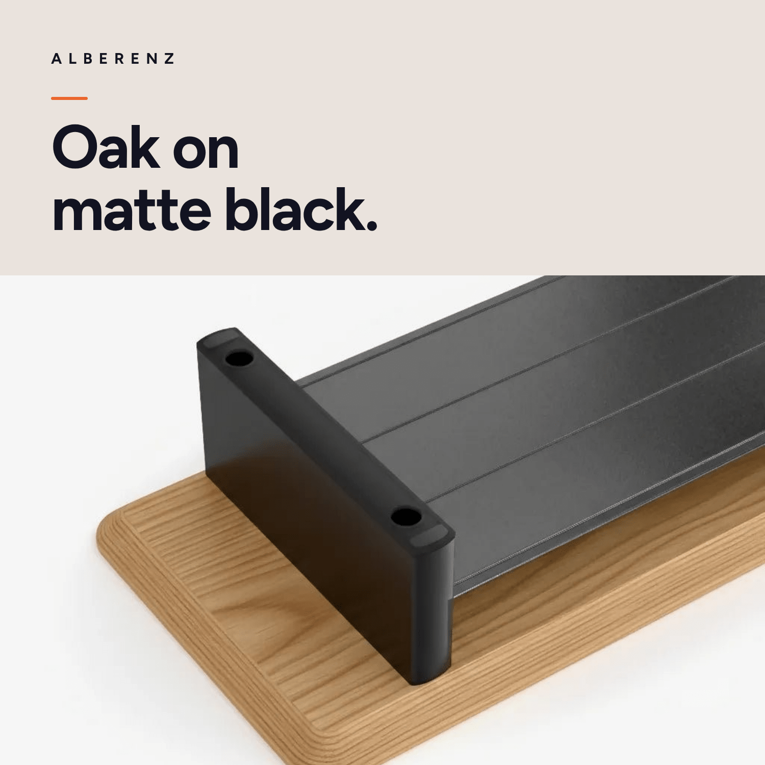 Alberenz gas spring monitor arm silver with oak monitor riser: oak top on a matte black leg, close-up